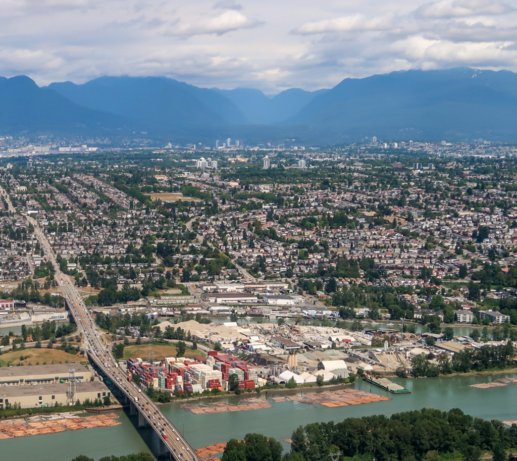 Victoria-Fraserview, Vancouver Aerial view looking north over the Fraser River at the tree-lined residential streets and houses on the slope of Victoria-Fraserview, Vancouver